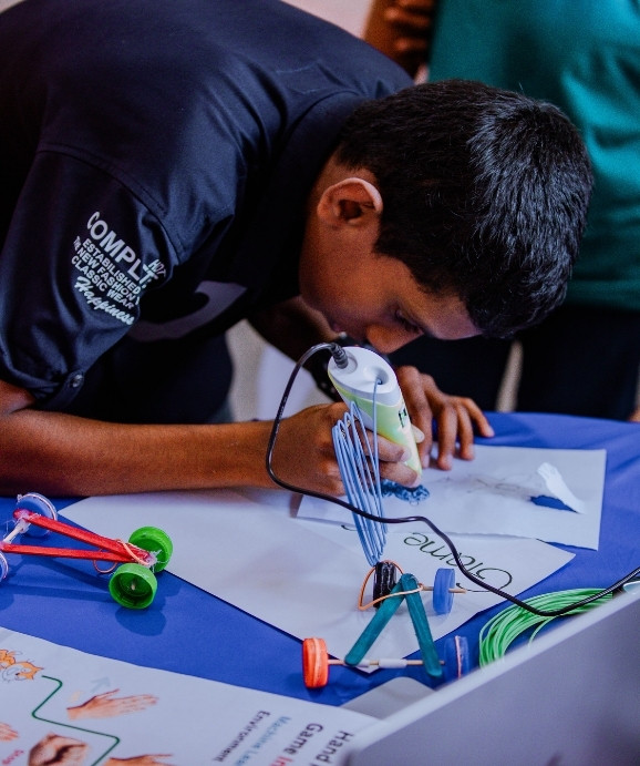 Instructor teaching software development to kids